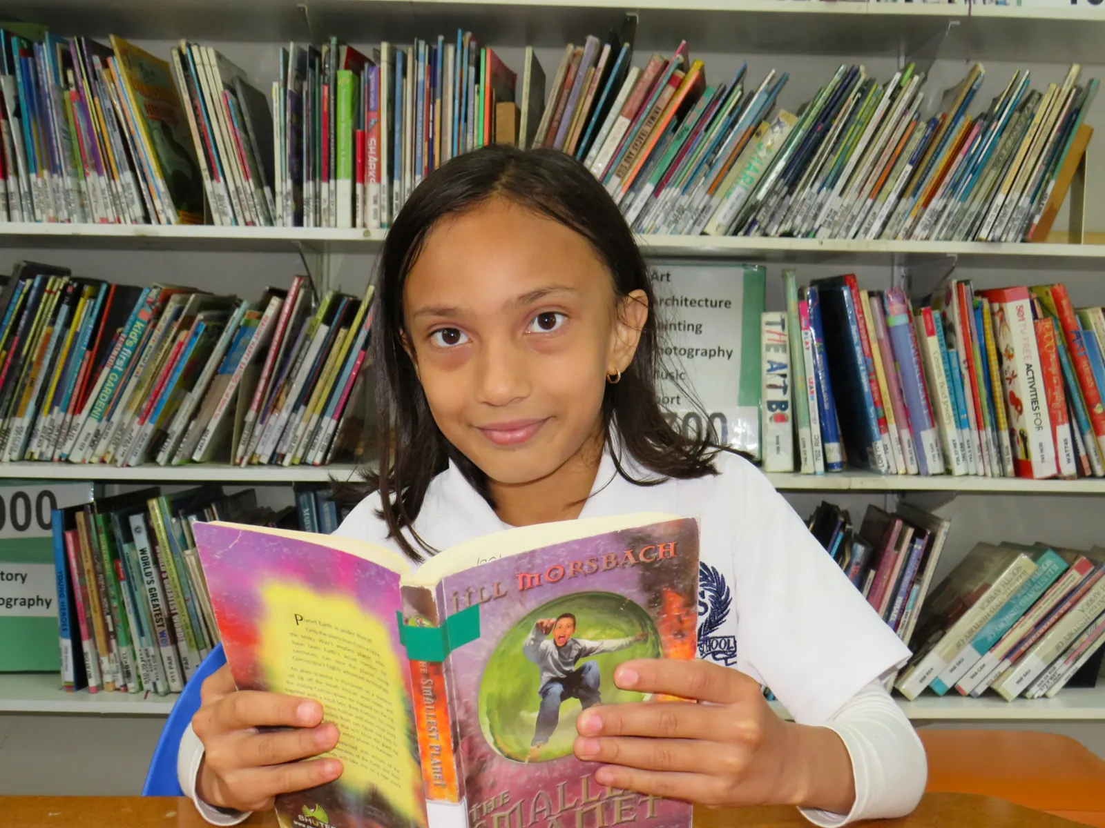 A Japari pupil reading in the school library