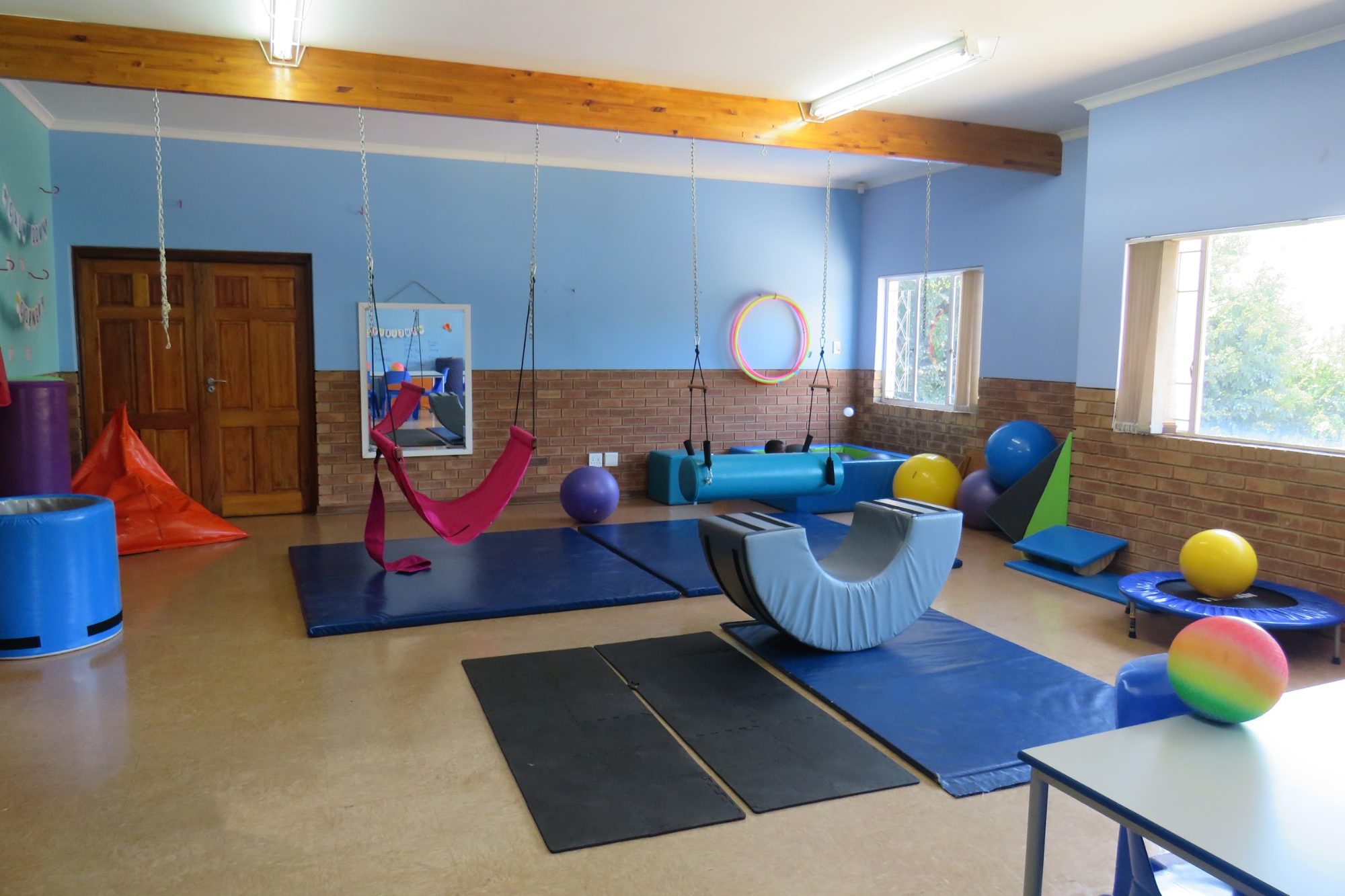 The occupational therapy room at Japari School, with swings, mats and therapy balls