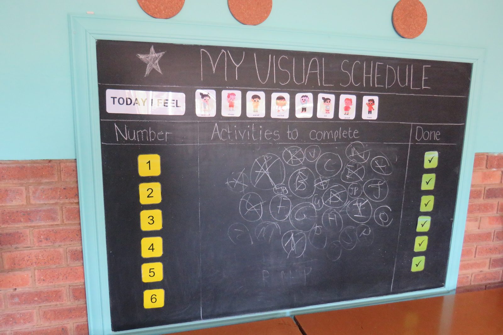 A chalkboard visual schedule in a Japari School classroom